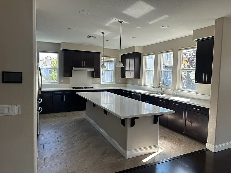 Airy and spacious gourmet kitchen filled with sunlight_ideal for everyday cooking and entertaining.