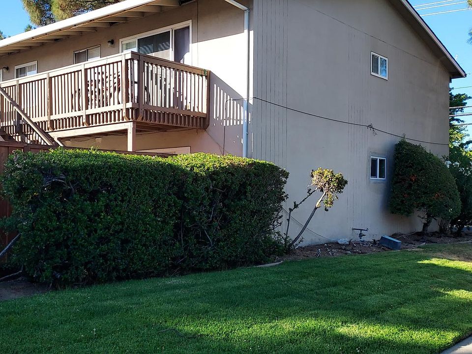 Front of building with grass (now replaced per city with low water landscape.)