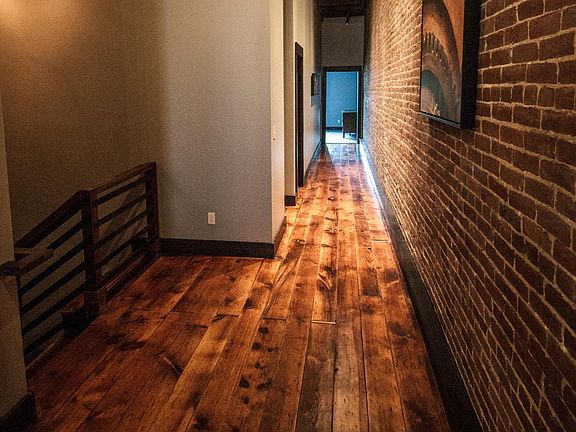 Hallway area, shows off the beauty of these original refinished hardwood floors