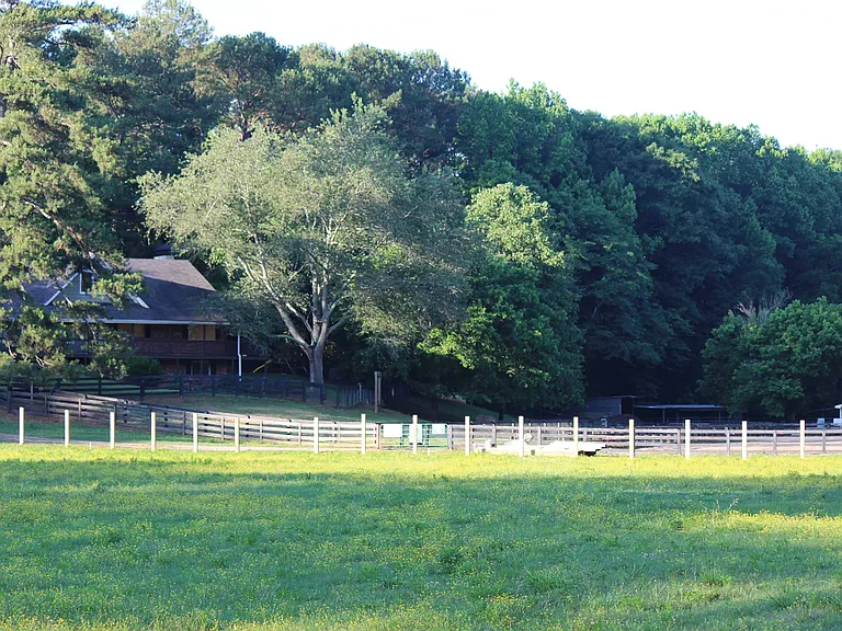 Lovely furnished farm home for rent on over 7 acres in Milton, GA. Set back & very private.