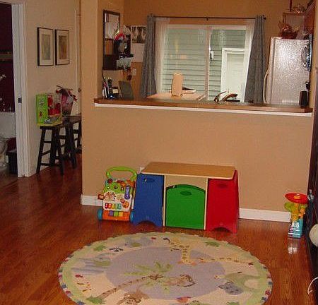 Dining room currently used for baby's play space. Lots of possibilities!