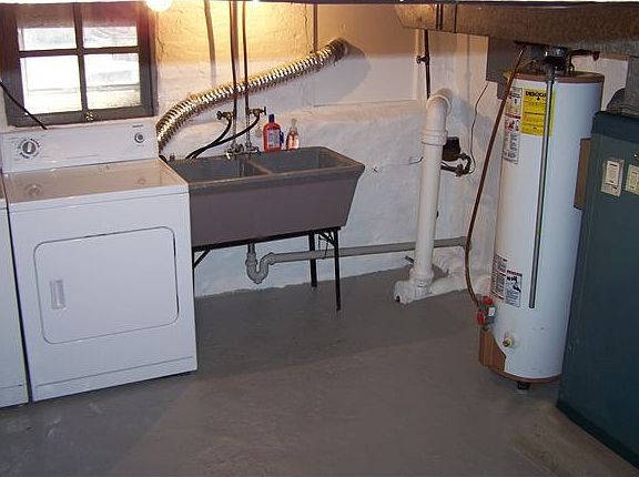 Bright basement with washer and dryer