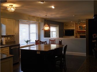 Large island and eating area with bay window