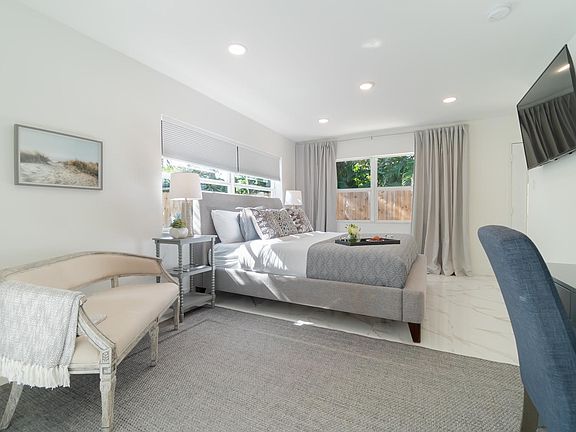 Master bedroom with large 55" Smart TV