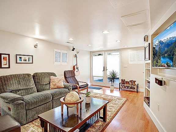 View of living room from in front of bathroom