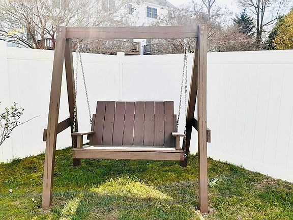 Fenced yard with swing