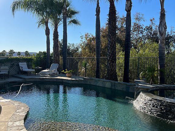 Large pebble tech pool, private yard