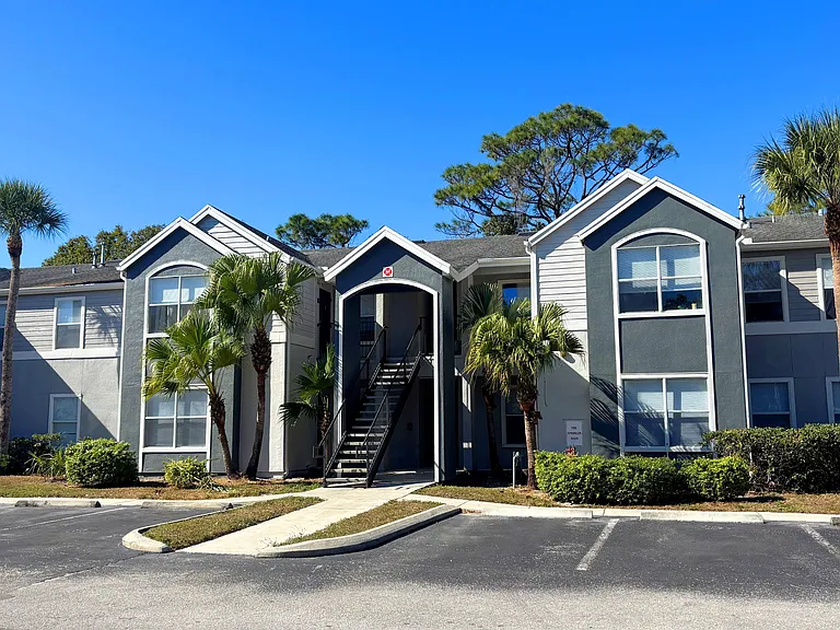 Modern paint, mature landscaping, and Florida palms welcome you home at Eden Pointe.