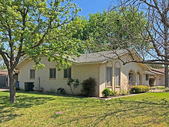 View from corner. Multiple trees, including a pecan that wi