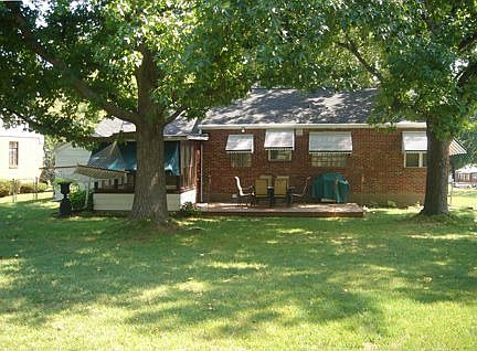 The large, level, fenced back yard with large deck is perfect for entertaining
