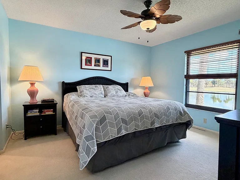 Spacious Primary Bedroom w/ STUNNING lake & golf course views & HUGE walk-in closet!