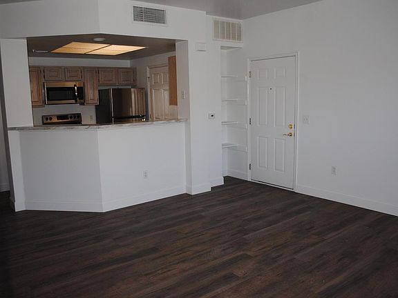 Living Room / Entry/ Open Kitchen. Note: the only stainless applicance is the microwave