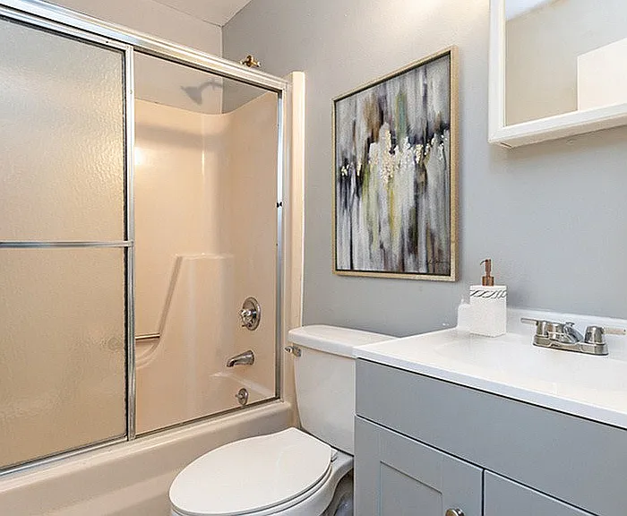 Experience the serene elegance of this modern bathroom design.
