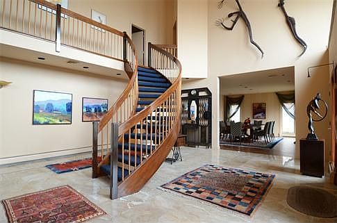 Magnificent Entry Foyer: Custom Rounded Floating Staircase