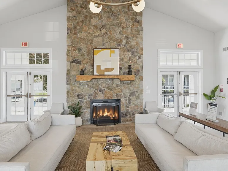 Step into the inviting atmosphere of Eagle Rock Apartments, where modern design meets cozy comfort. Enjoy the elegant stone fireplace and stylish furnishings, perfect for relaxation. Schedule your visit today to see your future home!