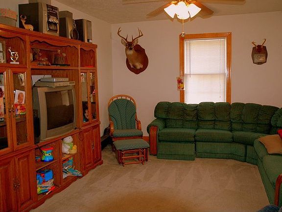 Family Room with Carpet & Ceiling Fan