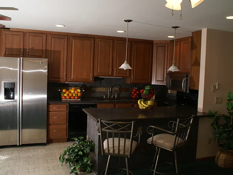 Place to entertain wile cooking dinner open concept allowing the cook to watch the game on TV in the living room wile preparing the Meal.