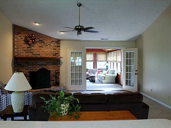 Great Room. Open & spacious great room with cathedral ceiling with ceiling fan. Doors open to bonus room.