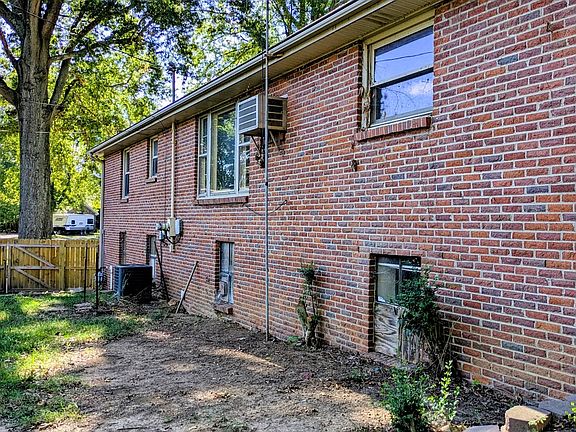 Back of the all brick home.