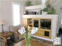 Living room w/hardwood and custom entertainment center