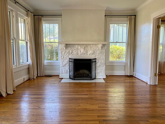 Living room with wood burning fireplace