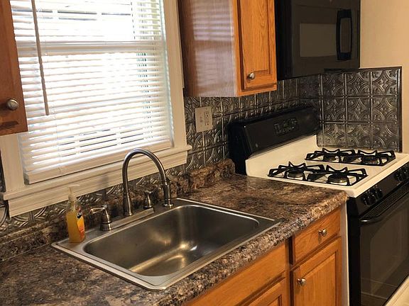 Gas Stove and New Microwave in Kitchen