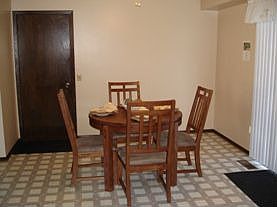 Dining area in kitchen with patio door to deck.