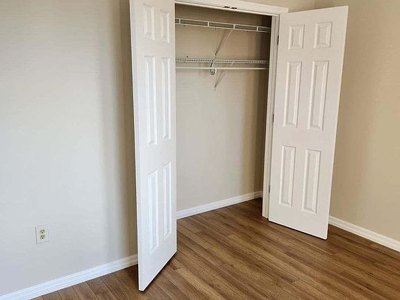 bedroom with closet and hanging rack