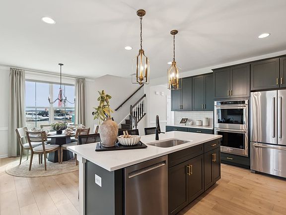 The kitchen and dining room of the Hemingway by Brookfield Residential.