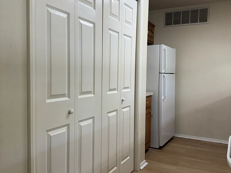 Gallery kitchen,view 2, with laundry closet.