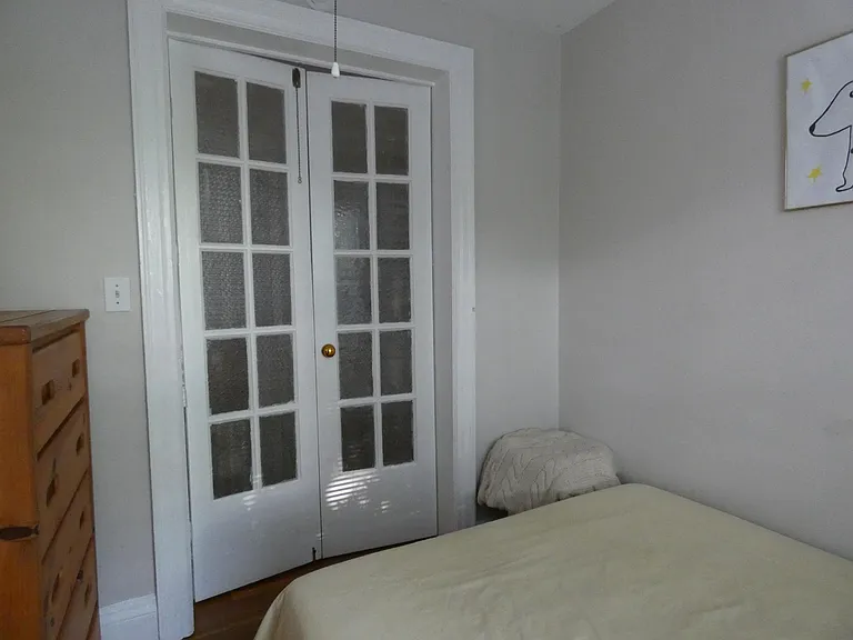 bed area with french doors closed