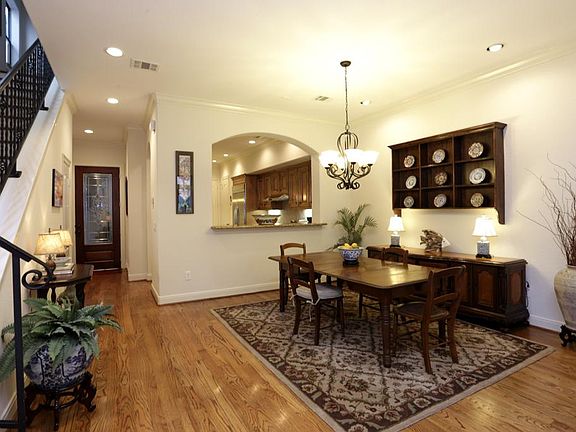 In this photo, you can see how large the first floor living and dining area is. The breakfast bar/se