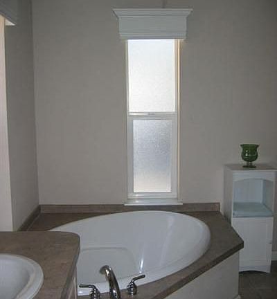 Large tub in master suite is perfect for relaxing