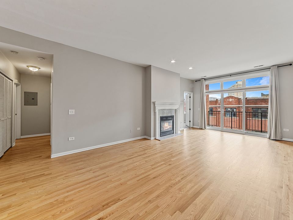 Hardwood flooring, 9-0 ceilings, fireplace private balcony off the living room.