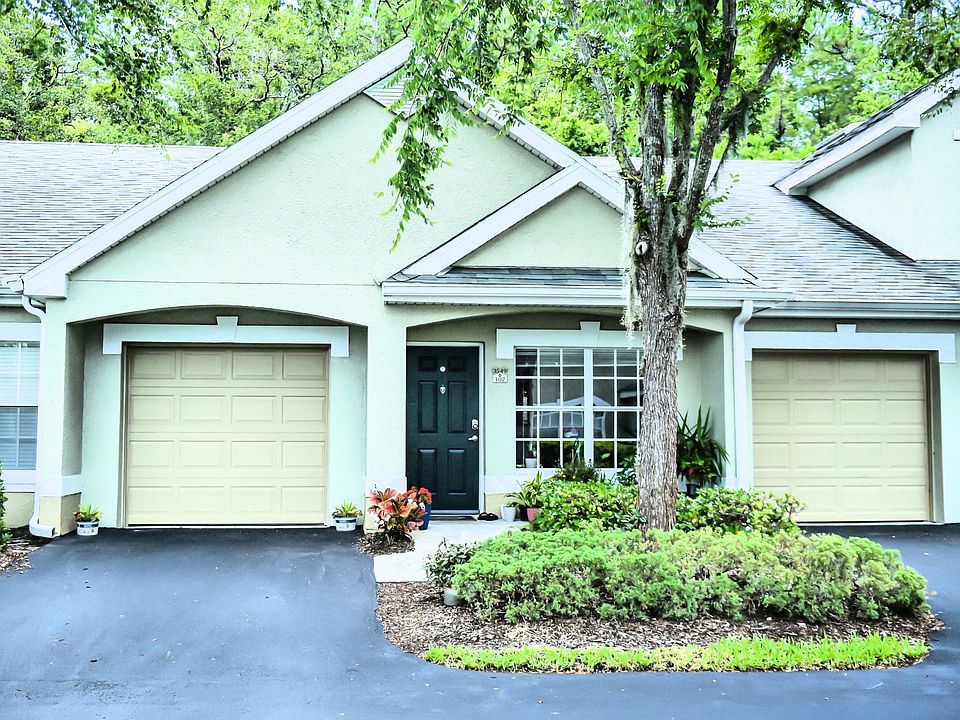Villa-style condo with private garage in gated Waterford community