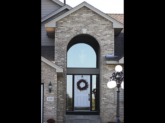 Half Moon Transom Window Above Entry Way & Entryway Sidelight Windows