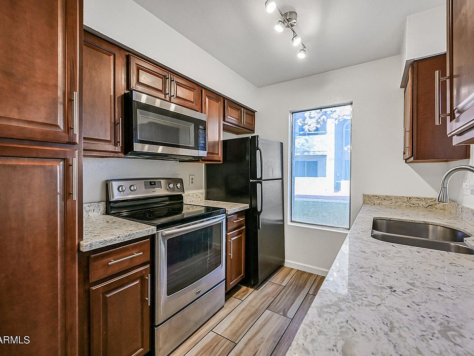 Kitchen with stainless steel appliances (microwave, stove, dishwasher, fridge)