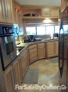 kitchen
						:
						travertine floors, stainless steel appliances