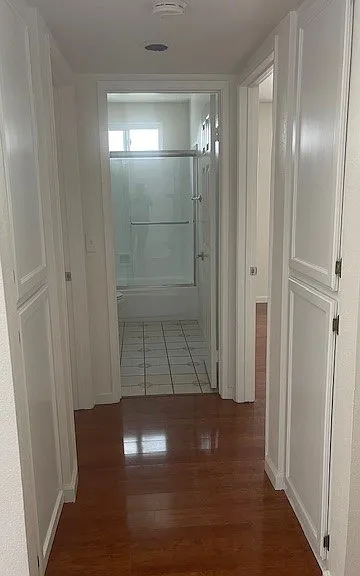 View of hallway from living space. Guest bath at the end of the hall, guest bed to the right and master bed/bath to the left. Hallway is all storage.