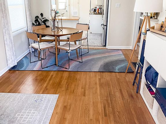 Dining area leading into kitchen