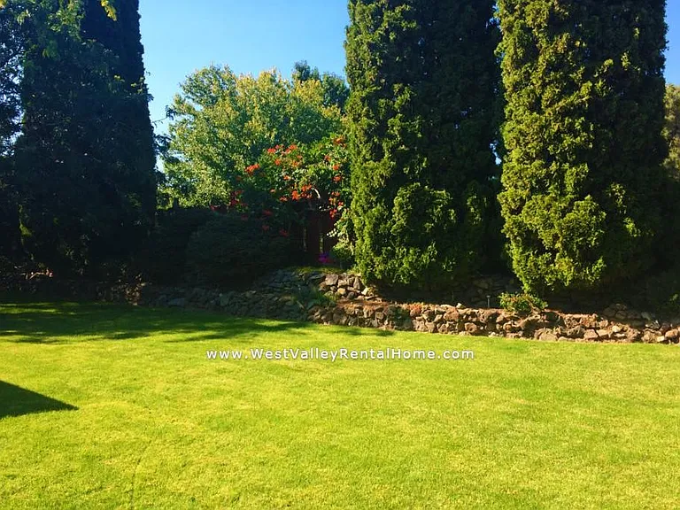 Beautiful large fenced, private backyard. Fantastic trees provide shade to enjoy the many warm days in Yakima.