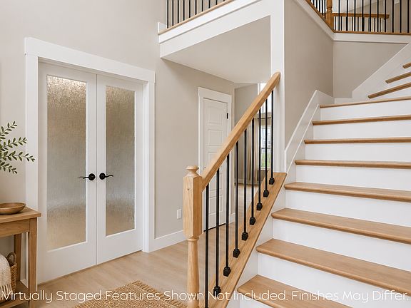 Light-filled foyer featuring architectural details and modern finishes