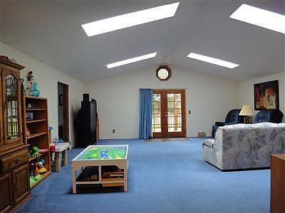 Large multi-purpose room, measures 24' x 24' with room for play area, dining area, office area, and 