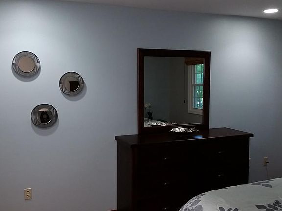 dresser with mirror in bedroom
