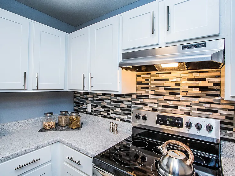 Experience the elegance of this sleek kitchen, perfectly blending modern design with functionality.
