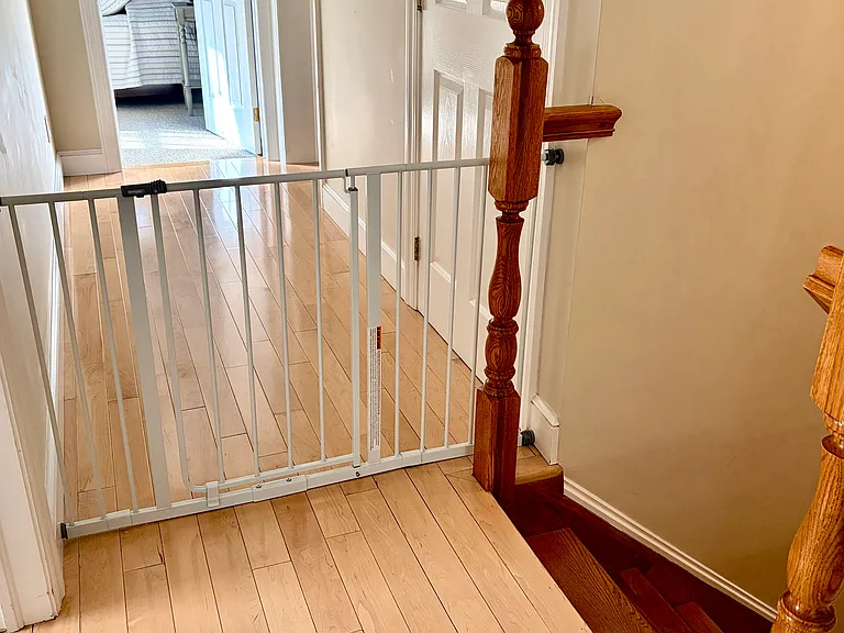 Option to have a safety gate with convenient walk-through door at top of stairs