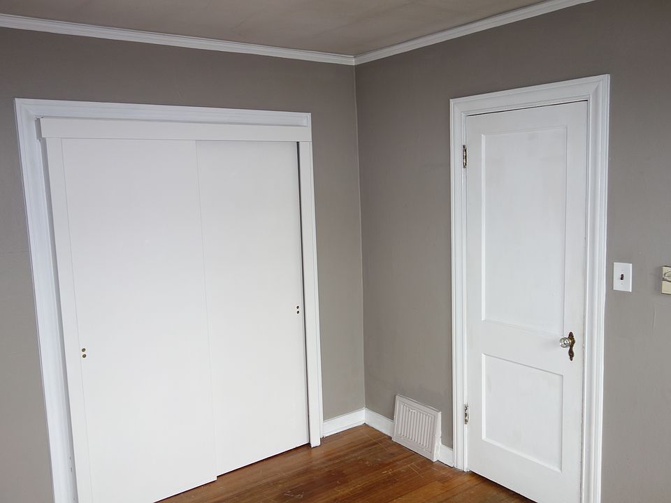 Bedroom 1 with original hardwood floors