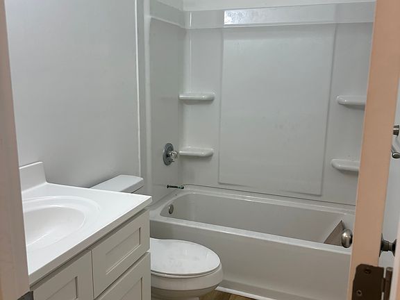 2nd shared bathroom with new tub/surround, toilet, vanity