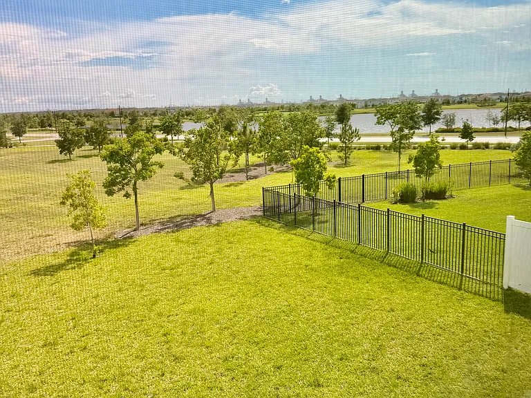 backyard views from upstairs bedrooms include mile long lake with greenspace