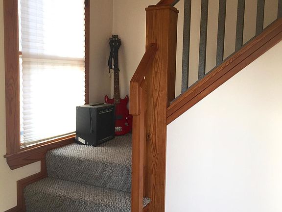 Stairs leading from coat area to apartment